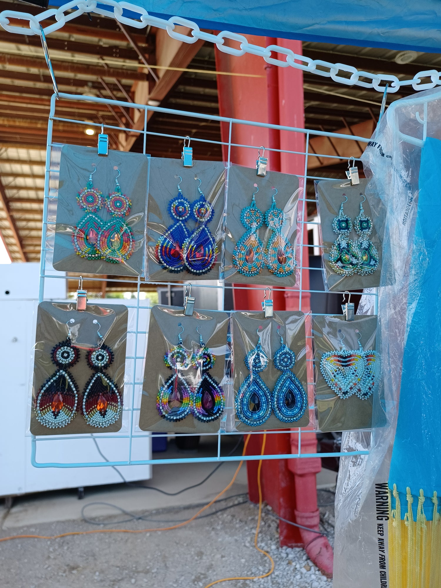 earrings on display at powwow booth